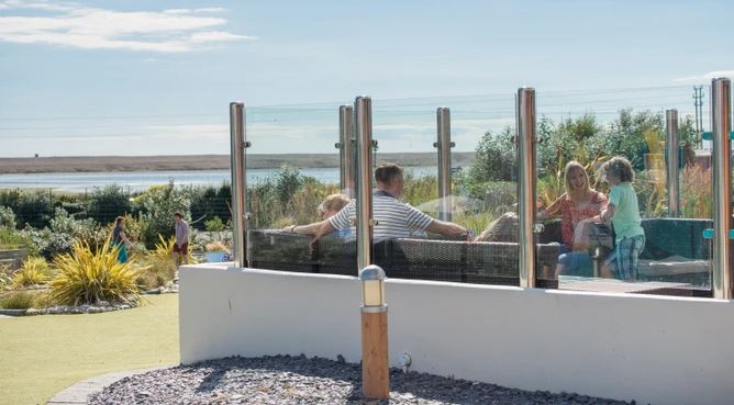 A family enjoying time together at Litttlsea holiday park in Dorset