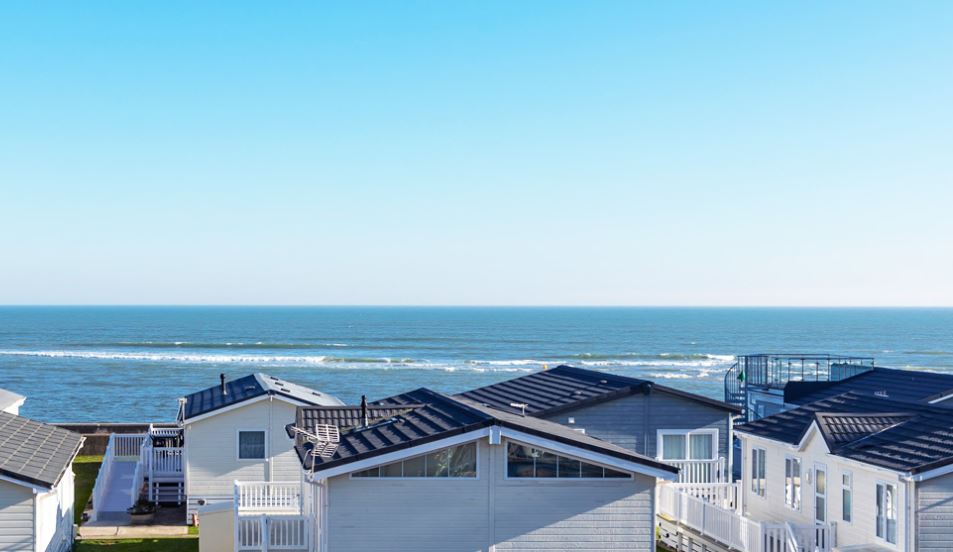 Holiday homes overlooking the sea, Dorset caravans on the beach