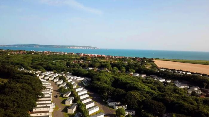 An image or the Holiday park from the sky with the beach in the background