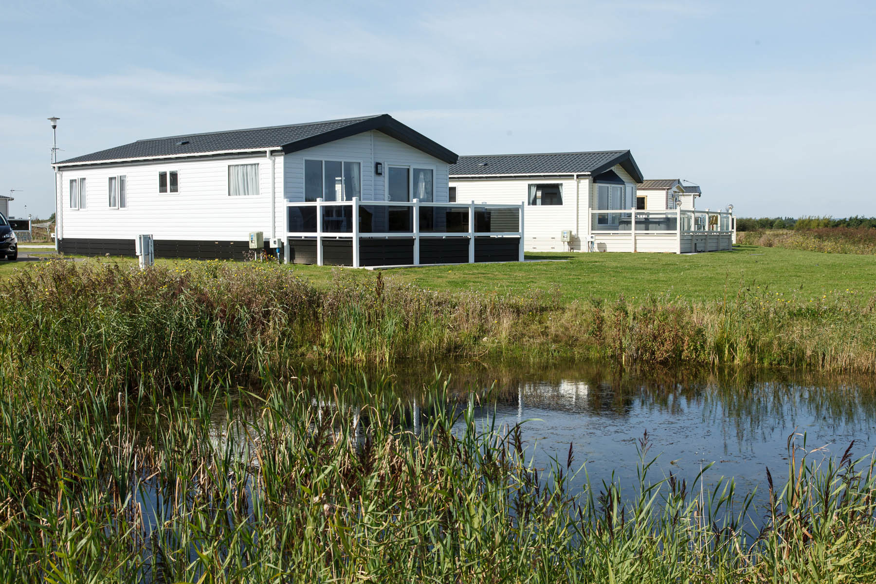 A view of holiday homes and lakeat Grange Leisure Park for Lincolnshire caravan holidays