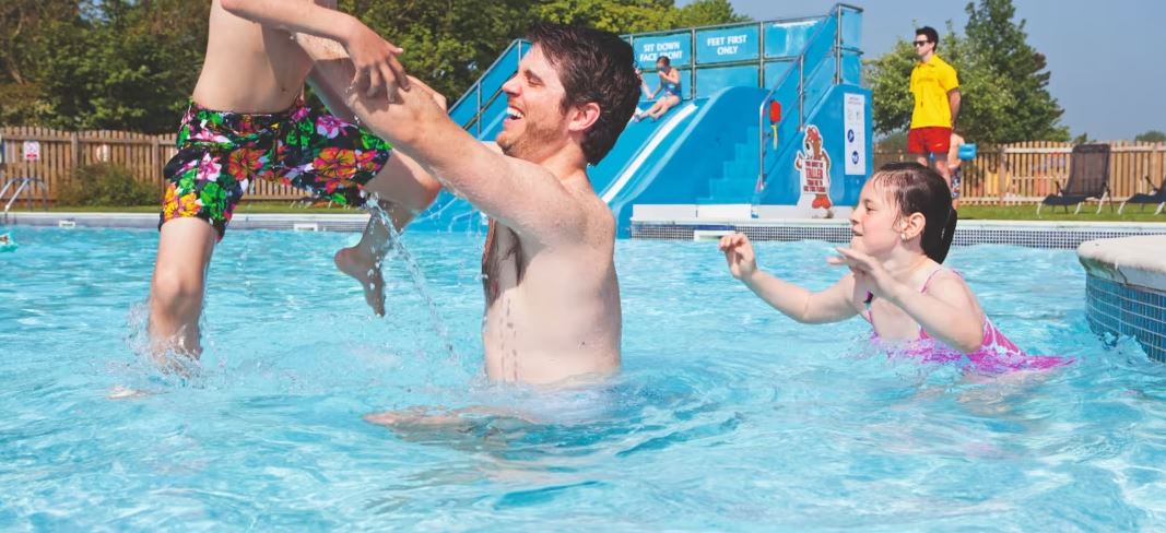 Having fun in the pool at dog friendly Kiln Park Holiday Centre