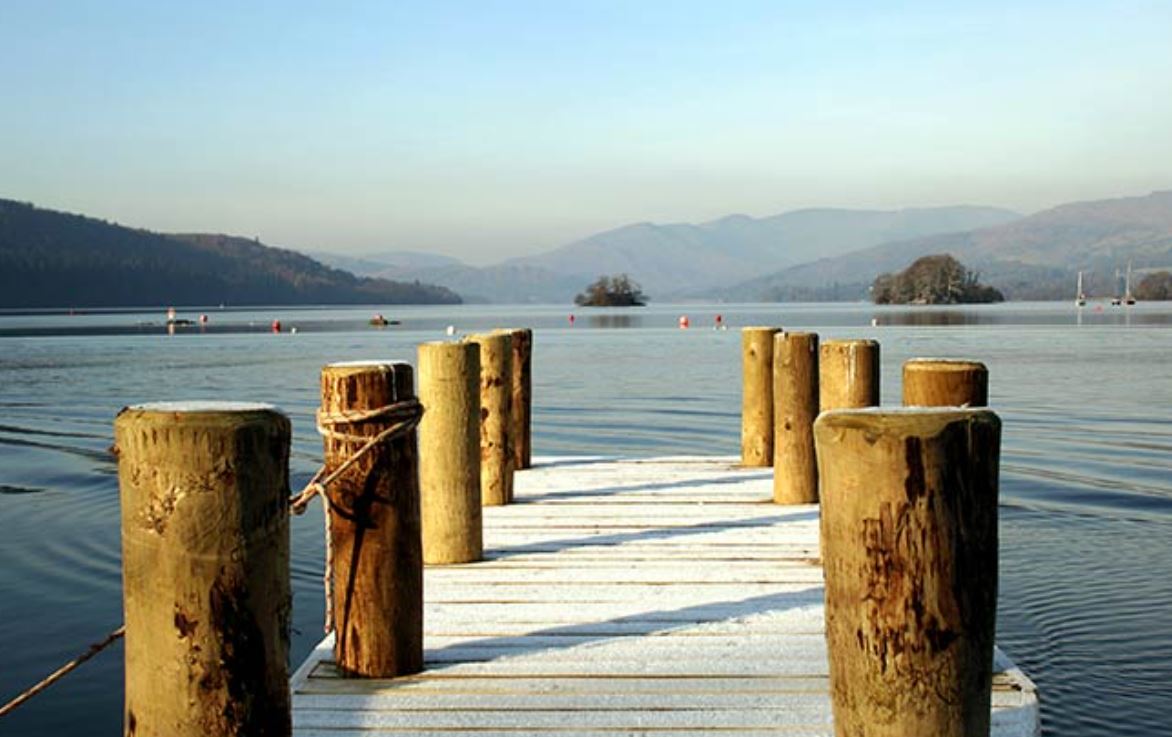 Snow covered lakeside decking at caravan parks in the Lake District