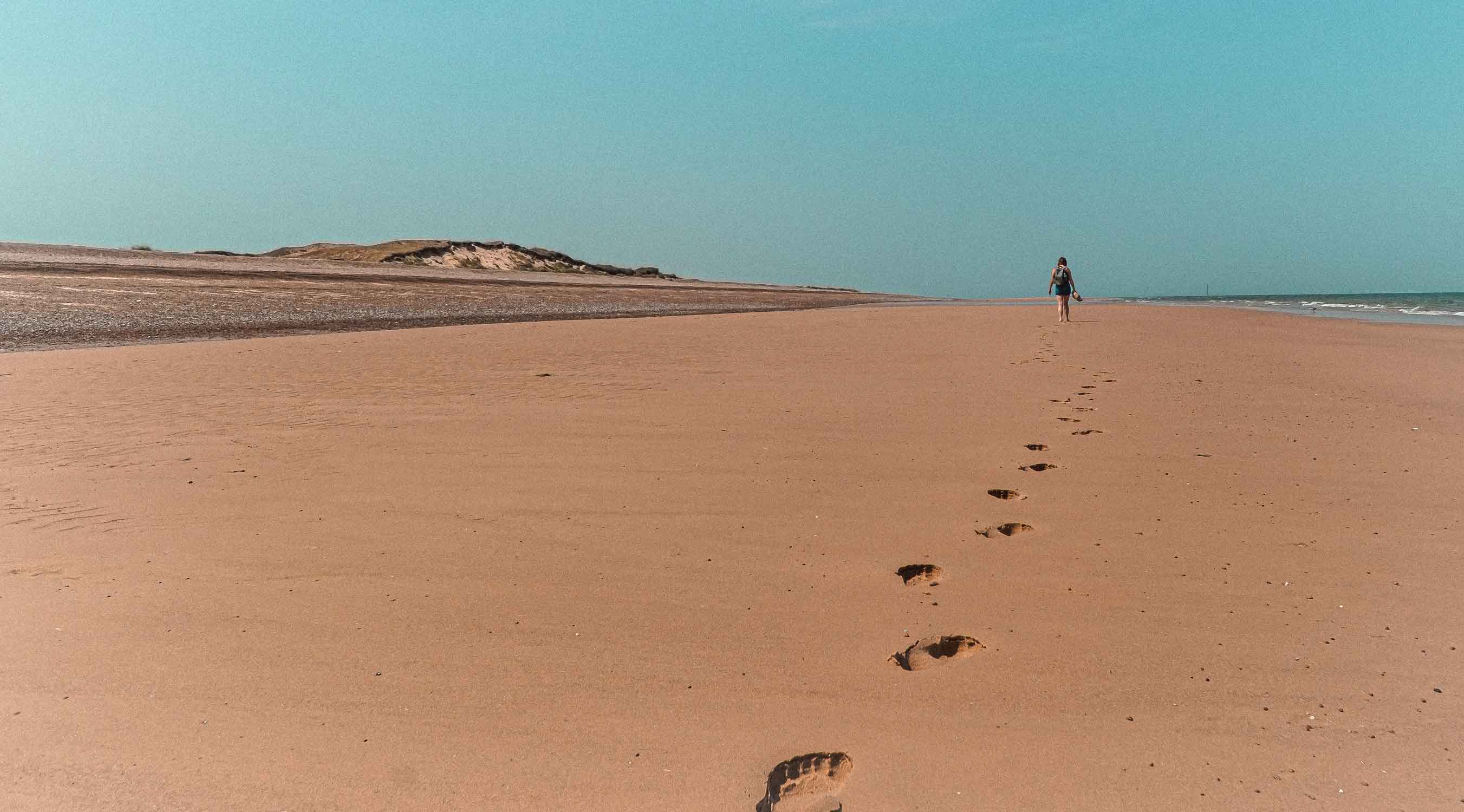 walking holidays in Norfolk Along Blakney Beach on a Bright Sunny Day