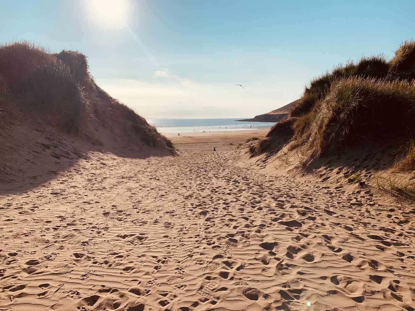 View of the North Devon Coastline Through the Sand Dunes, ideal for Walking Holidays in Devon