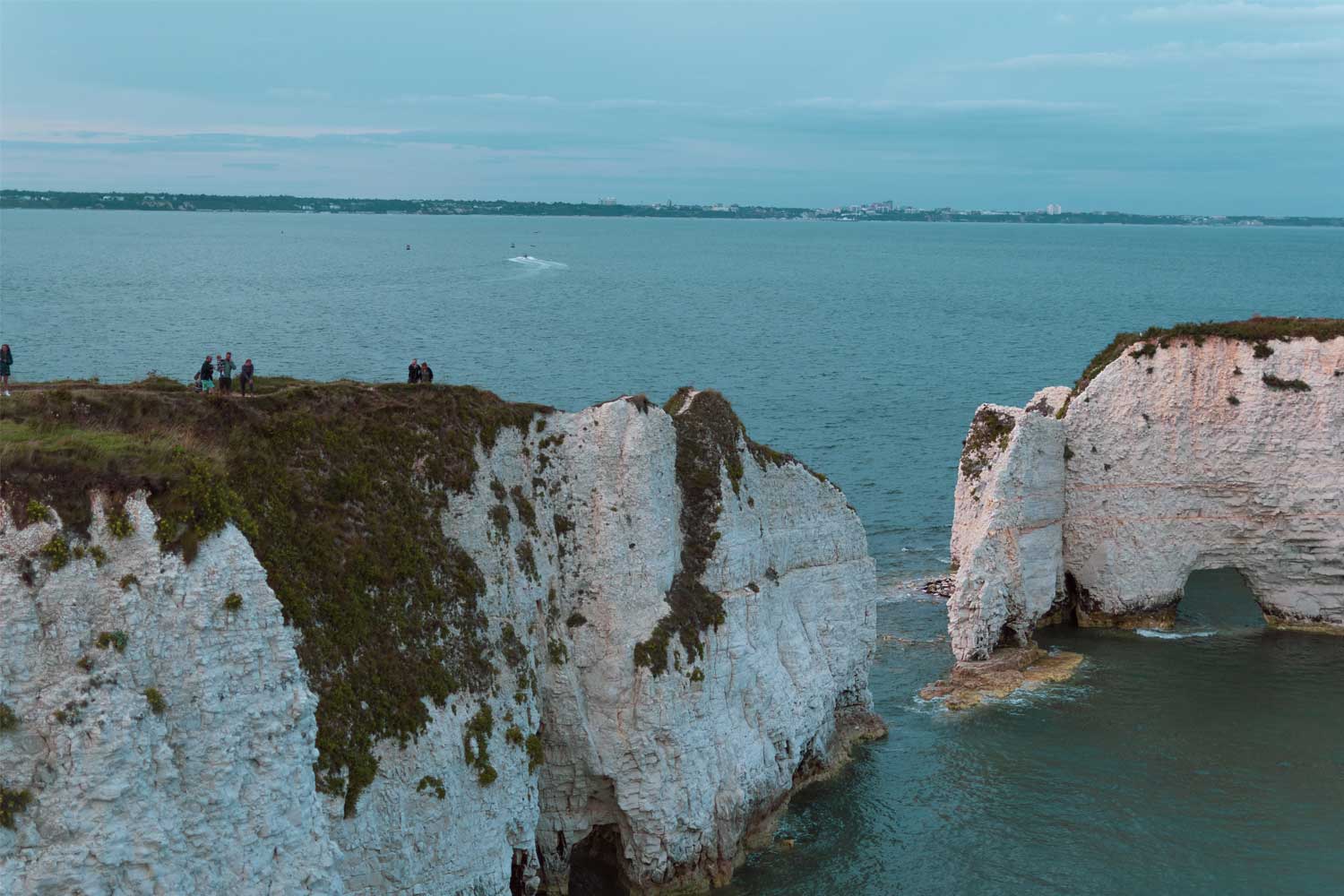 People Walking Along a Cliff Top at Durdle Door Dorset a great walk in somerset
