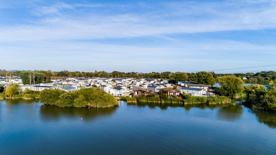 An Arial shot of Holiday Homes next to a Lake