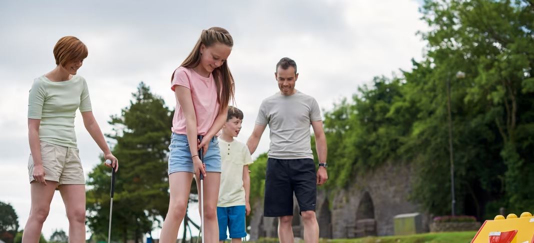  A Family Enjoying a Game of Golf