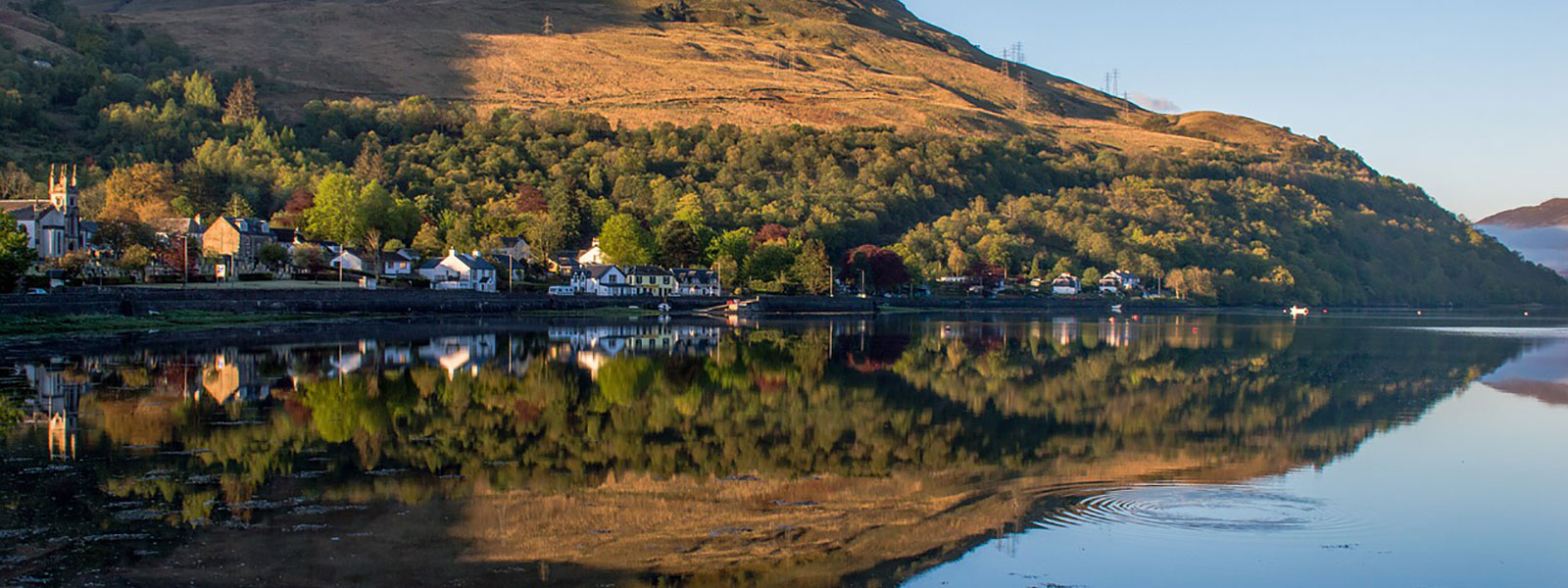 A view of a Village and Loch Lomond, great for family holidays