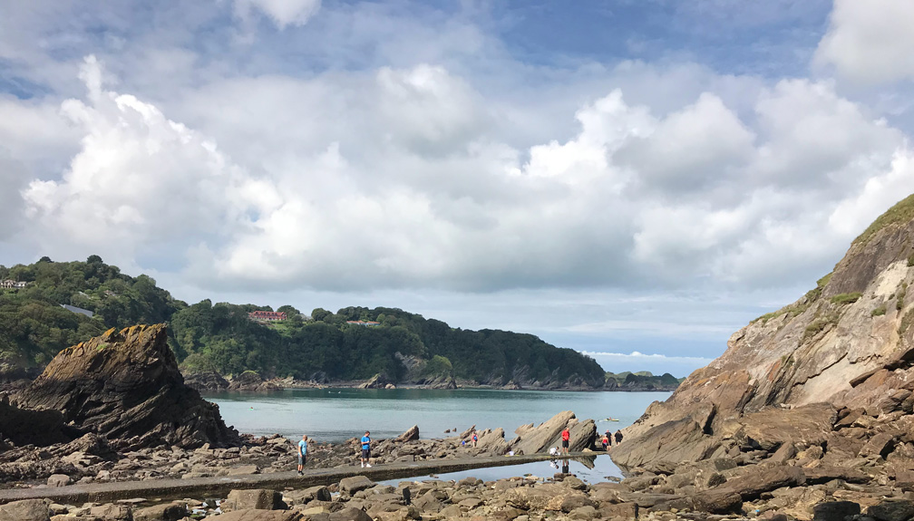 Families Exploring Rock Pools on a North Devon Beach