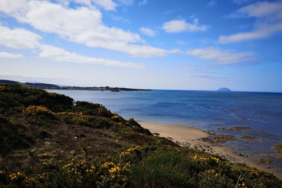 A view of a Scottish Beach looking out to Sea and Ailsa Craig