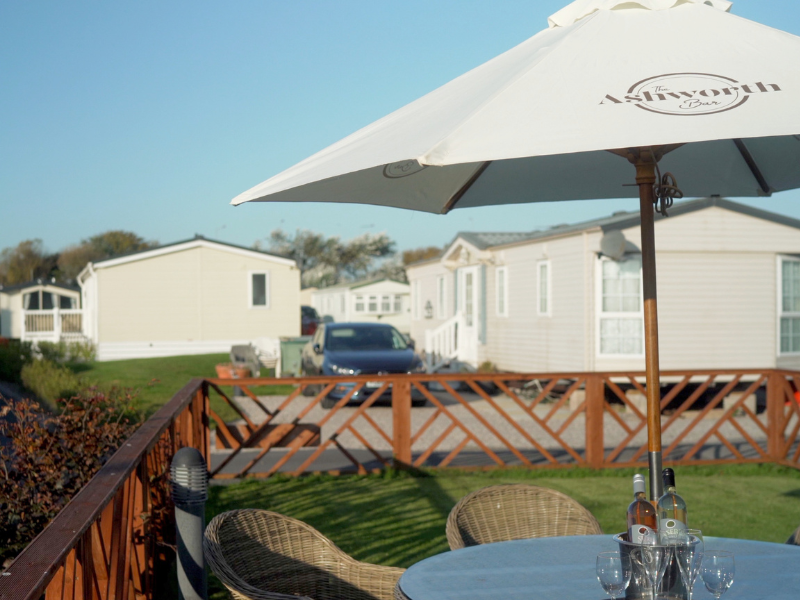 An Image of Caravan Holiday Homes in Blackpool with a Outdoor Bar Table