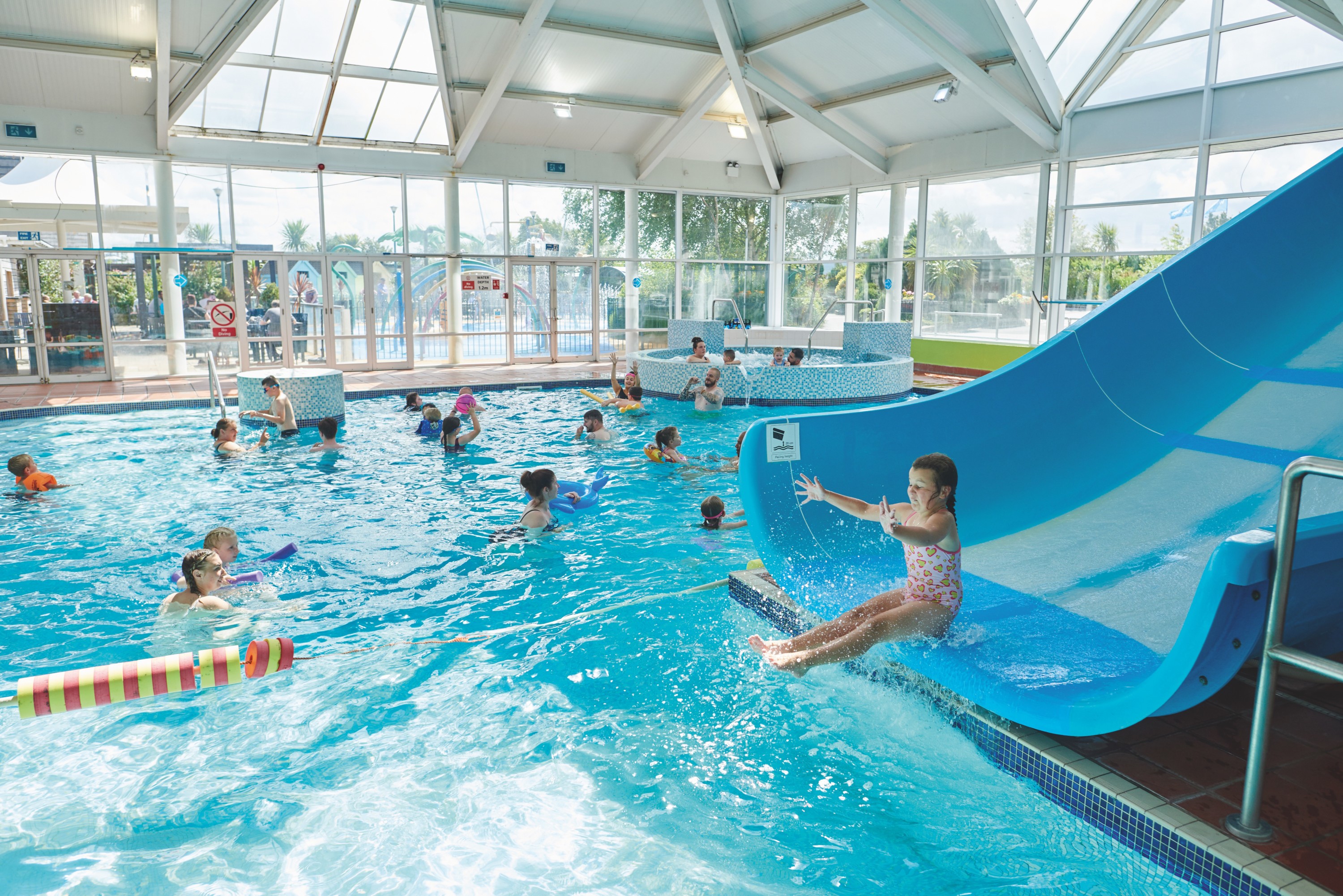 People Enjoying Time in the Indoor Pool at Cala Gran caravan Park in Blackpool