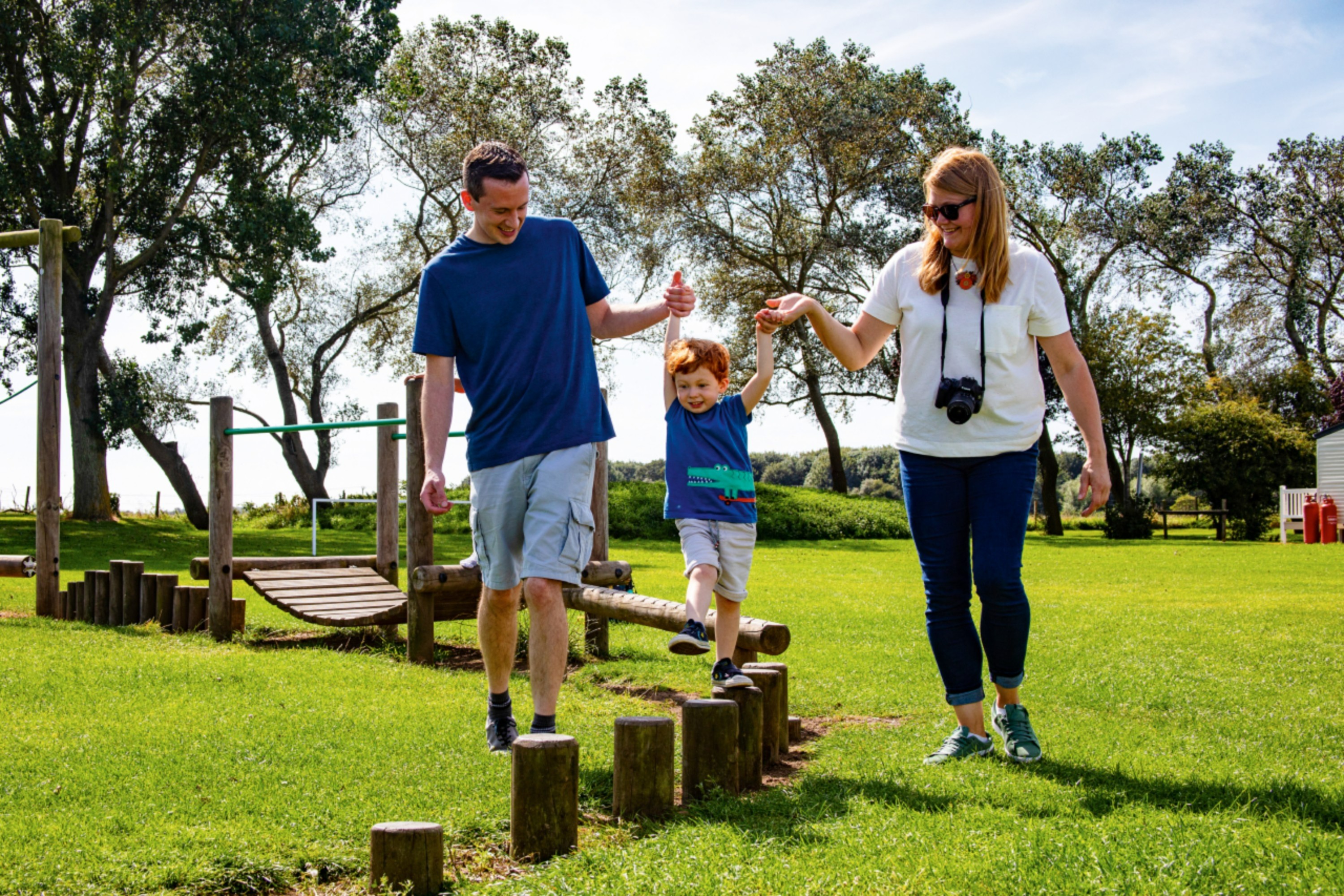 A Family Playing on an Outdoor Playground on a Holiday Park in Skegness