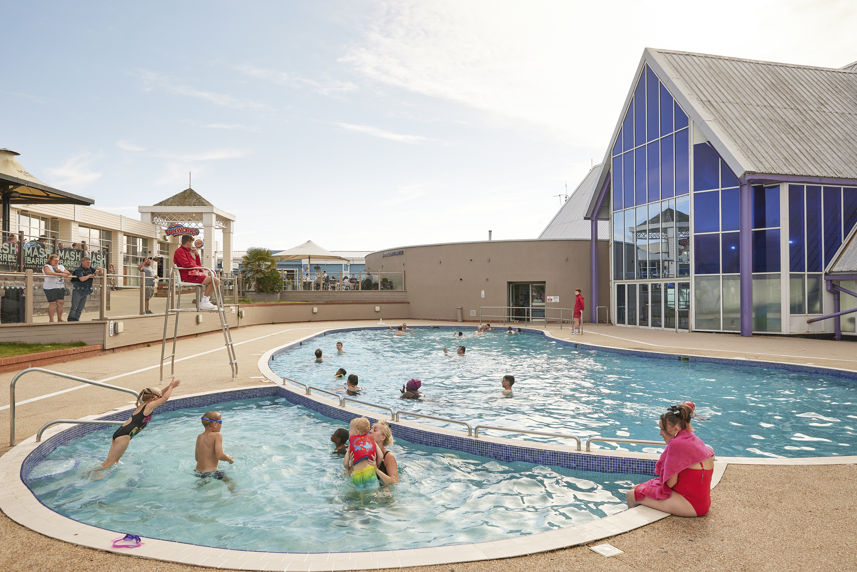 People Enjoying Time in the Outdoor Pool at the Holiday Park