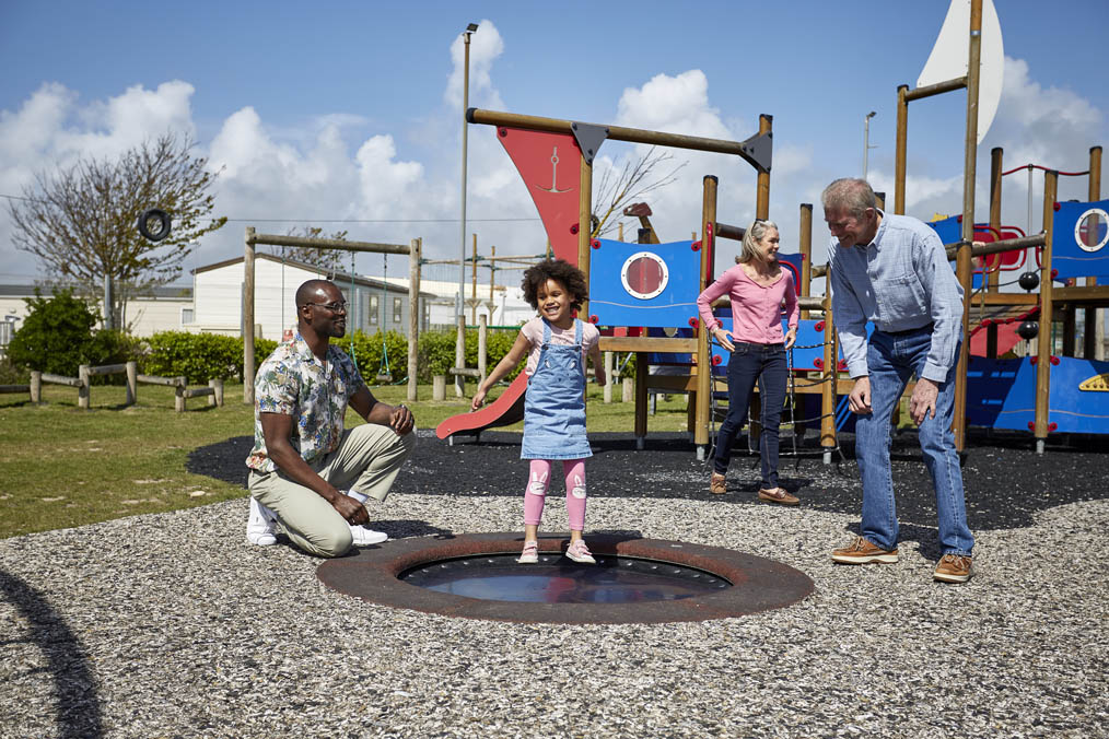 Family having fun on an Adventure Playground on a Holiday Park