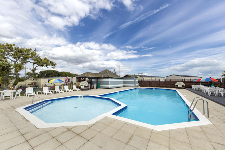 Two Swimming Pools and Patio Area on a Holiday Park