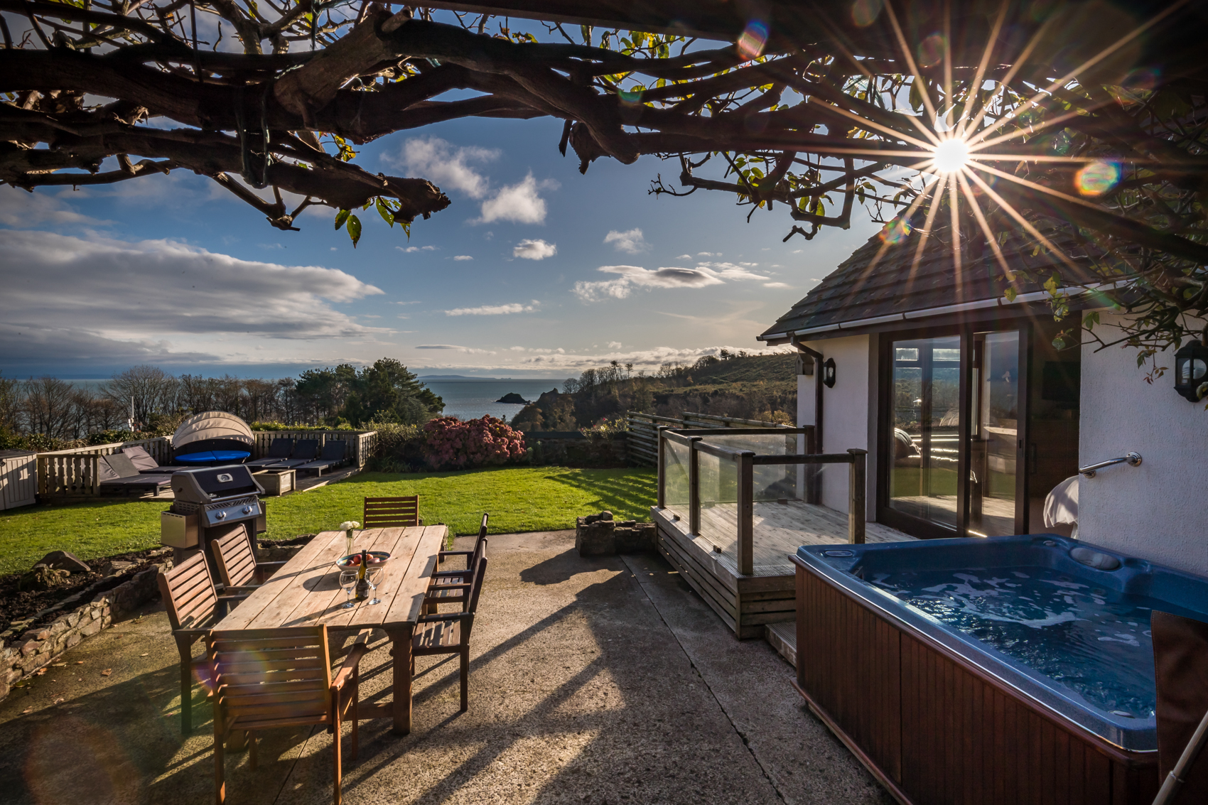Holiday Accomodation with an Outdoor Dinning Area, Garden and Private Hot Tub all with Sea Views