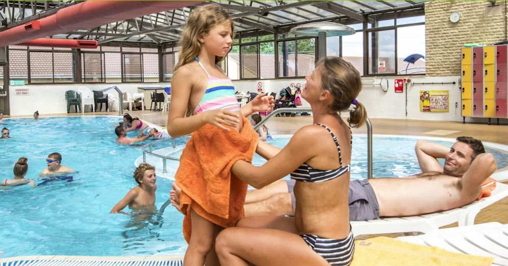 People inside an Indoor Swimming Pool at a Holiday Park in Somerset
