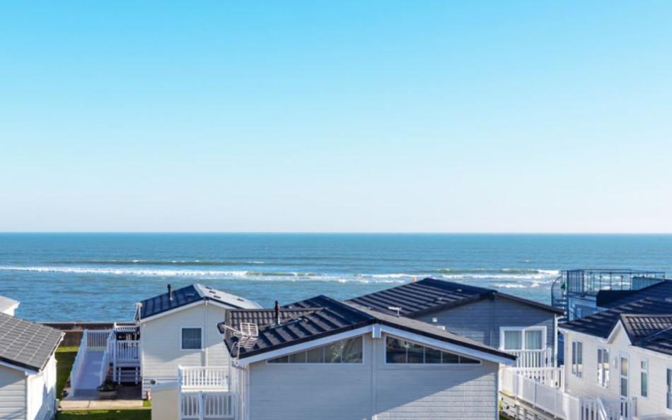 Holiday homes overlooking the sea, Dorset caravans on the beach