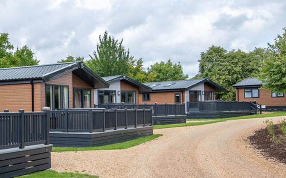 A row of caravans with decking 