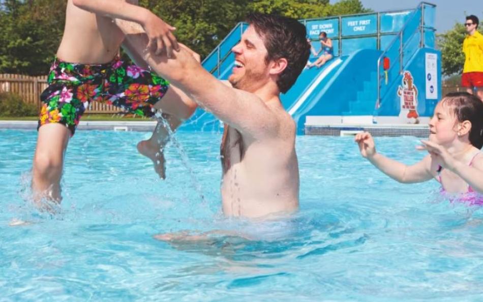 Having fun in the pool at dog friendly Kiln Park Holiday Centre