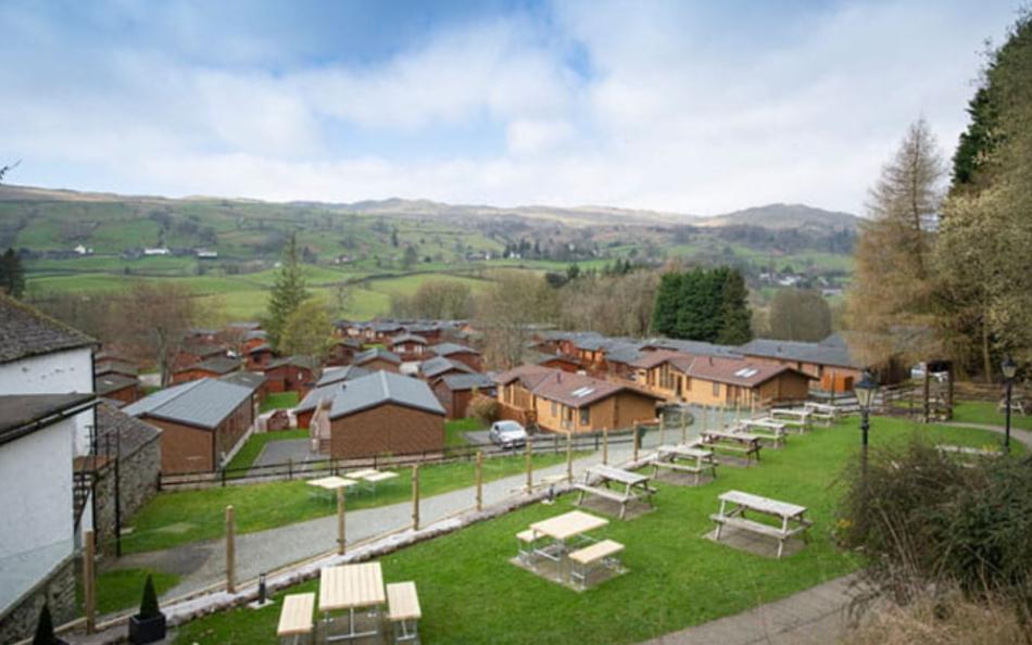 A view of multiple holiday homes from up high down to the valley