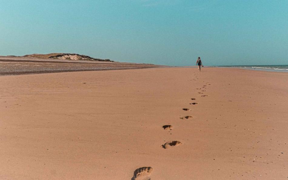 walking holidays in Norfolk Along Blakney Beach on a Bright Sunny Day