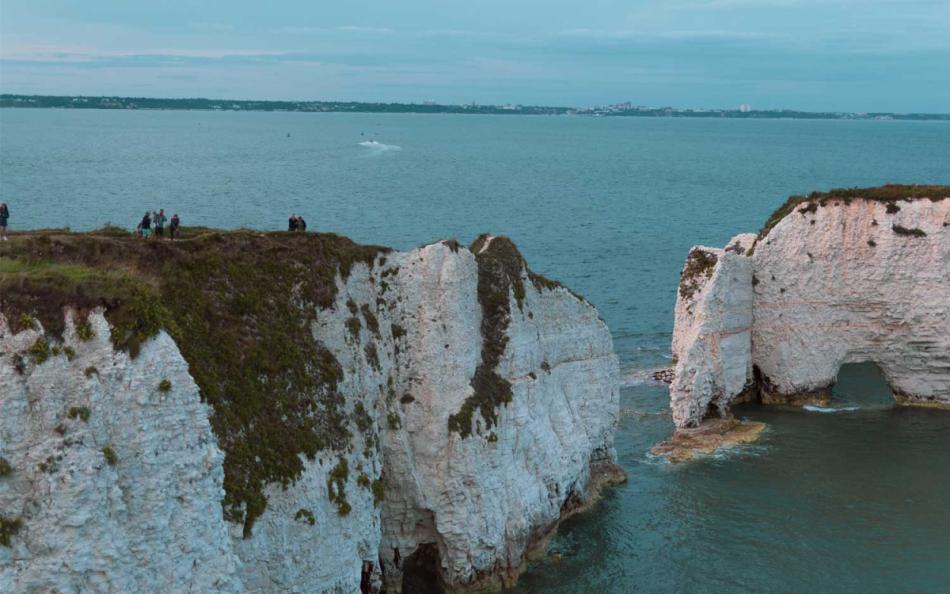 People Walking Along a Cliff Top at Durdle Door Dorset a great walk in somerset