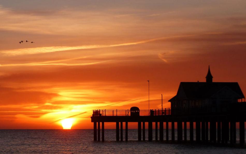 A Sunset with a View of a Pier in Suffolk