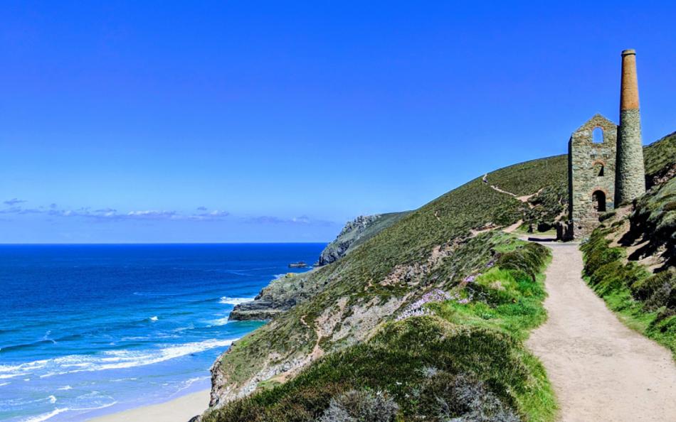 An Image of Bright Blue Sea and Tin Mine on the Cornish Cliff-side