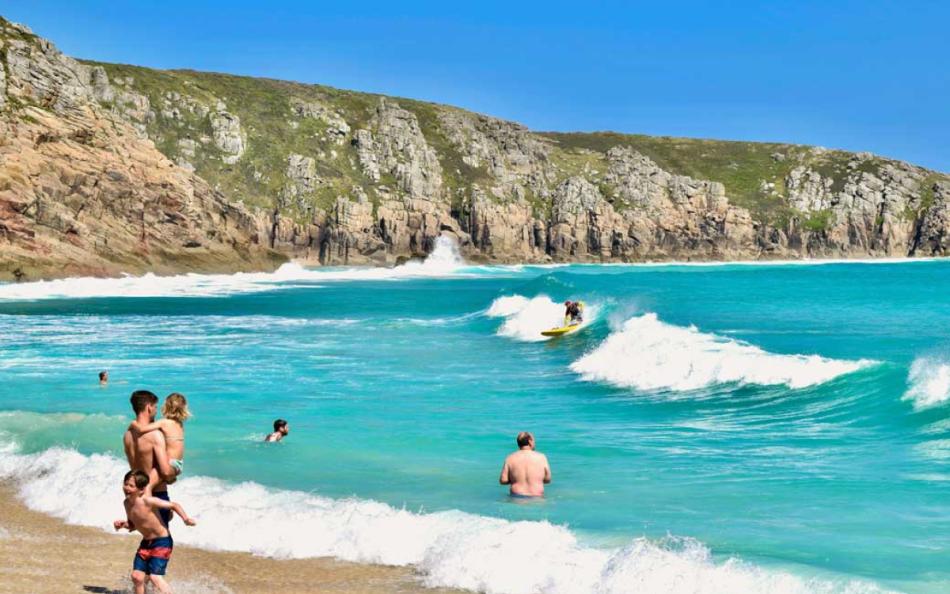 A Family About to Enjoy Playing in the Sea on a Cornish Beach