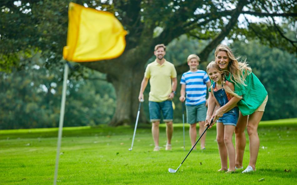 A Family Playing Golf on the Holiday Parks Onsite Golf Course in Cornwall 