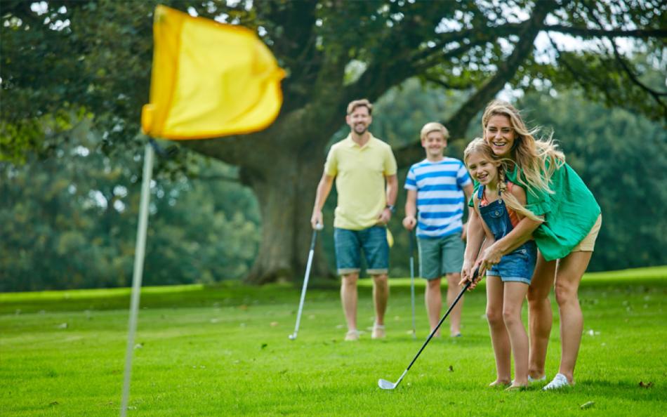 A Family Playing Golf on the Holiday Parks Onsite Golf Course in Cornwall