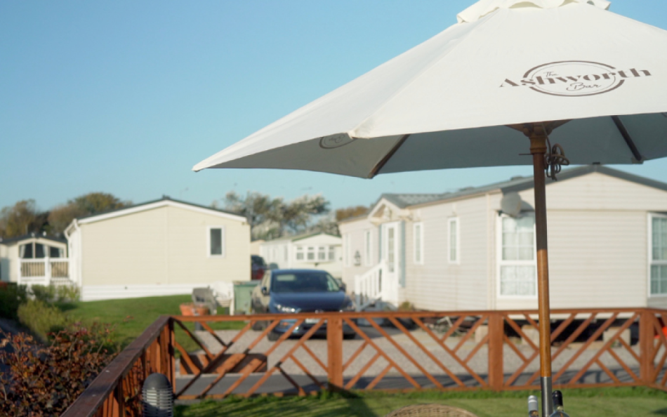 An Image of Caravan Holiday Homes in Blackpool with a Outdoor Bar Table