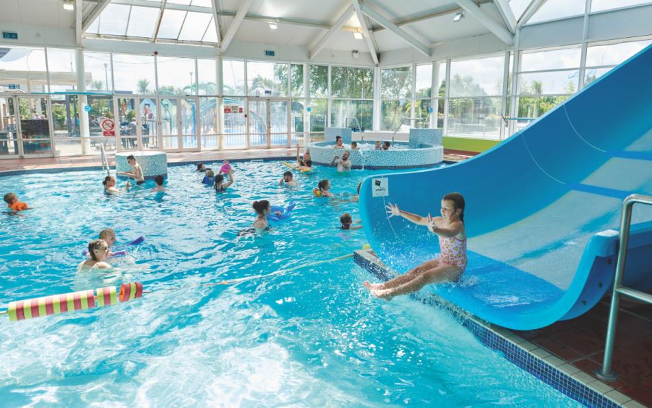 People Enjoying Time in the Indoor Pool at Cala Gran caravan Park in Blackpool