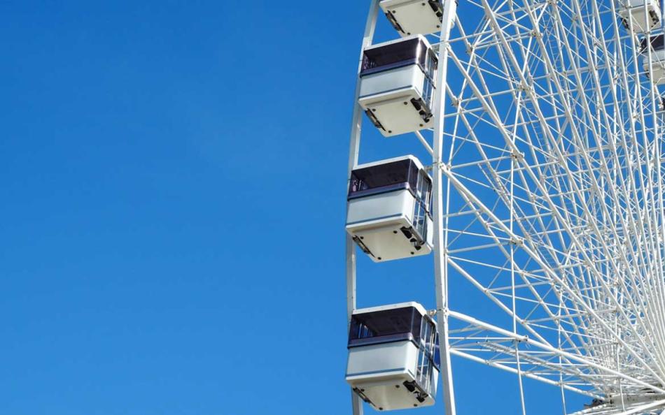 An Image of a Ferris Wheel set against a Bright Blue Sky in Great Yarmouth