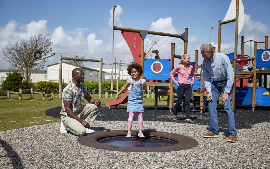 Family having fun on an Adventure Playground on a Holiday Park