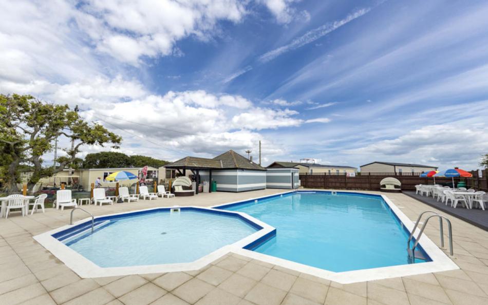 Two Swimming Pools and Patio Area on a Holiday Park