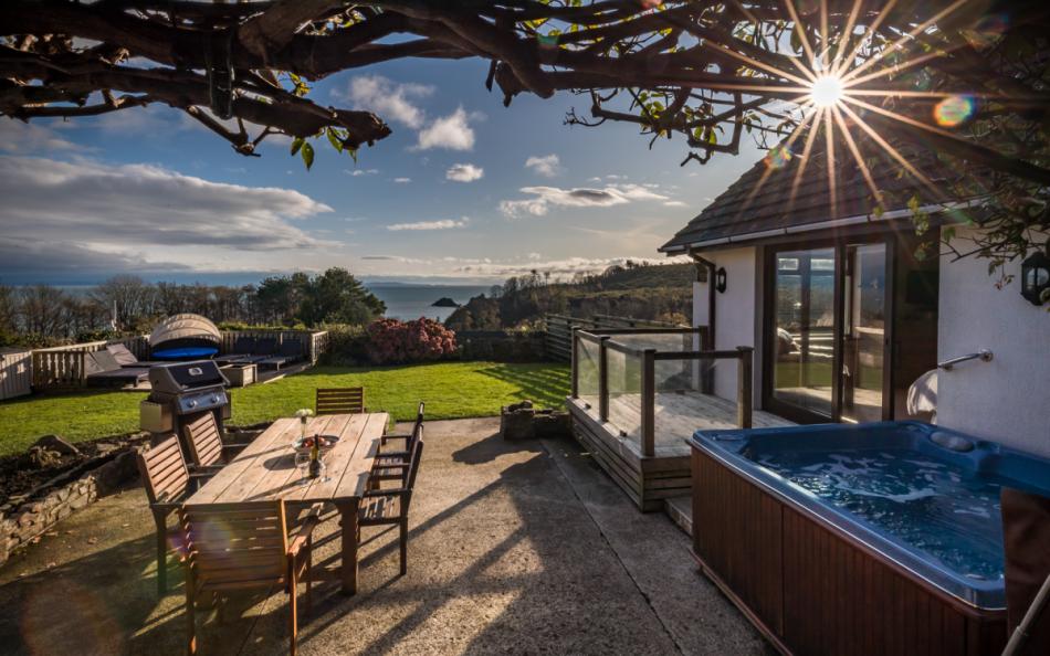Holiday Accomodation with an Outdoor Dinning Area, Garden and Private Hot Tub all with Sea Views