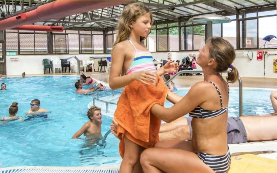 People inside an Indoor Swimming Pool at a Holiday Park in Somerset