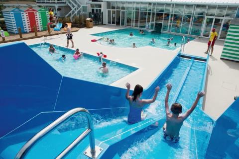 the slides and outdoor pool at Riviere Sands Holiday Park