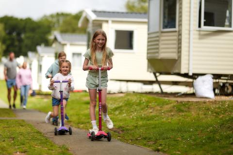 Languard Holiday Park kids playing by caravans