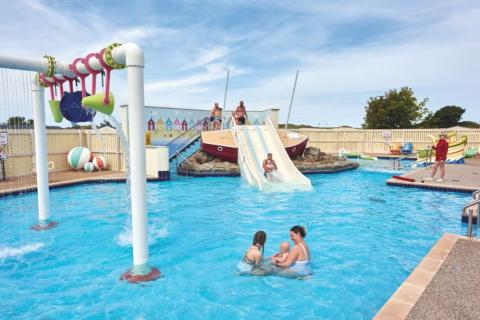 the outdoor pool with slides at Presthaven Beach Resort