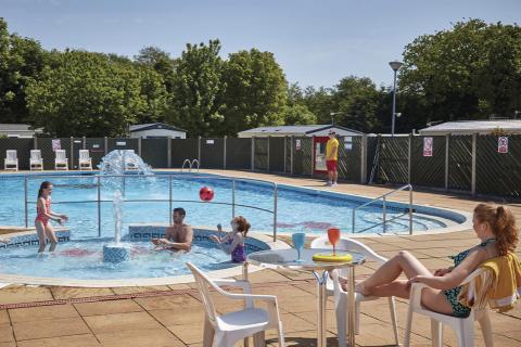 the outdoor pool with water features at Cherry Tree Holiday Park