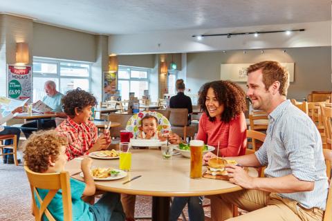 enjoying a meal on holiday at Summerfields Holiday Park