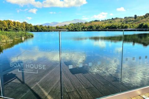 looking out from the boathouse at the lake at Brynteg Holiday Park