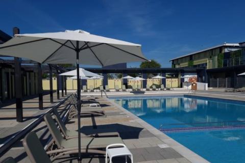 seating by the outdoor swimming pool