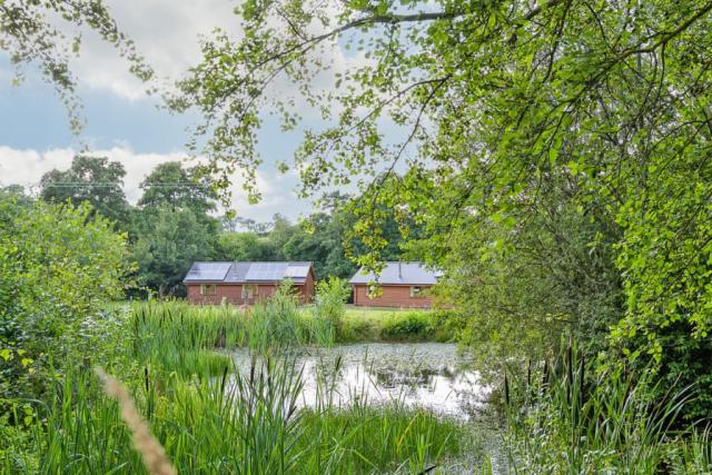 lake at ford farm lodge park in gloucestershire