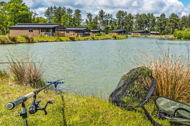 fishing lake at woodhall country park lodges in lincolnshire