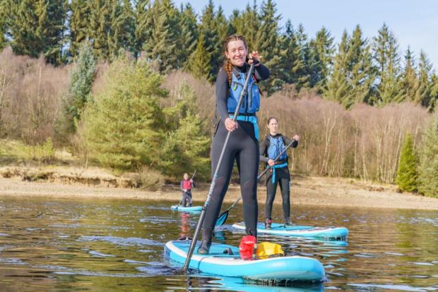paddle boarding at kielder waterside holiday park 